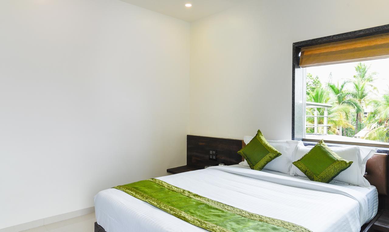 Treebo Malhaar Regency Hotel Chinchvad Eksteriør billede